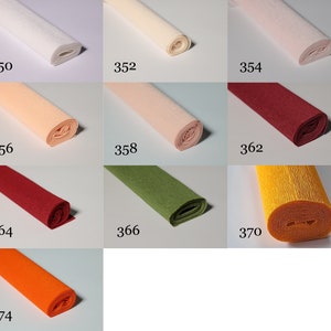 May include: Assortment of 10 rolls of crepe paper in various colours, including white, cream, peach, red, green, yellow, and orange. Each roll is labelled with a number, starting with 350 and ending with 374.