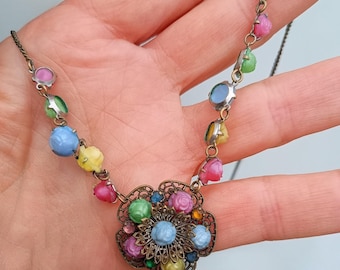 Vintage Art Deco Harlequin Glass Necklace: Carved Rose Beads, Brass Filigree Flower Pendant