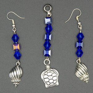 Pendants and earrings in a set with glass beads and charms