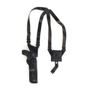 May include: A black leather shoulder holster with a magazine pouch. The holster has adjustable straps and a snap closure.