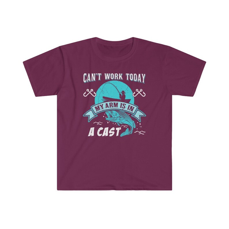 May include: A maroon t-shirt with a blue graphic of a fisherman in a boat with the text "Can't work today, my arm is in a cast".