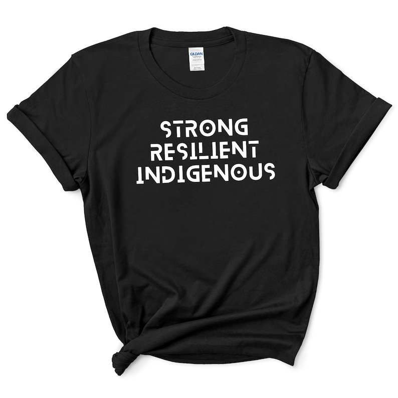 May include: Black t-shirt with white text that reads "STRONG RESILIENT INDIGENOUS".