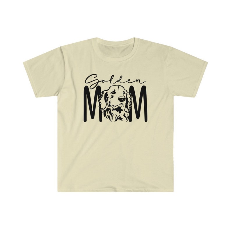 K&ouml;nnte beinhalten: Ein hellbeiges T-Shirt mit schwarzem Text, der "Golden Mom" lautet, und einer schwarzen Silhouette eines Golden Retriever-HundeKopfes.
