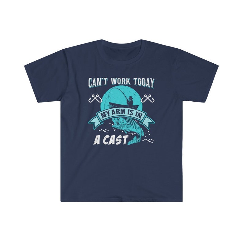 May include: Navy blue t-shirt with a graphic of a fisherman in a boat with a fish jumping out of the water. The text on the shirt reads "Can't work today, my arm is in a cast."