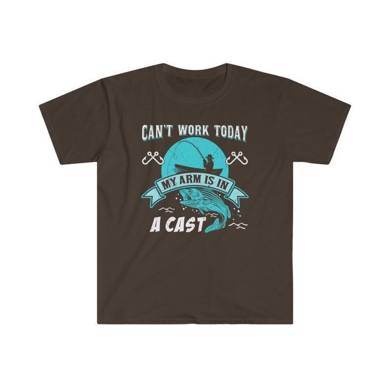 May include: A brown t-shirt with a blue graphic of a fisherman in a boat with a fish on a hook. The text on the shirt reads "Can't work today, my arm is in a cast."