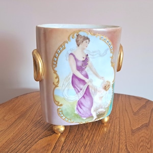 May include: A trio of ceramic mugs with a speckled, matte finish in light blue, cream, and grey. The mugs have a simple, modern design with a rounded shape and a comfortable handle. Ideal for tea or coffee.