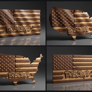 May include: Four different wood carvings of the American flag. The flag is carved in the shape of the United States, and the words "We the People" are carved into the bottom of the flag. The carvings are made of a light brown wood with darker brown accents.