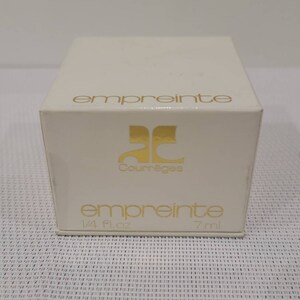 May include: A white box with gold lettering. The box contains a bottle of Courr&egrave;ges Empreinte perfume. The box reads "empreinte" and "Courr&egrave;ges" in gold lettering. The box also reads "empreinte" and "1/4 fl. oz. 7 ml."