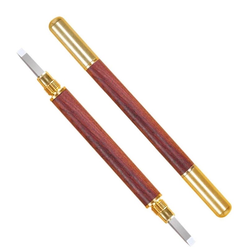 May include: Two wooden handled tools with gold metal tips and a silver blade. The tools are used for scraping and carving.