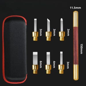 May include: Set of 7 gold-toned metal tools with different sized blades, ranging from 3mm to 6mm, in a black carrying case. The tools are used for crafting and detailing. The set also includes a 150mm long wooden tool with a 11.5mm gold-toned metal tip.