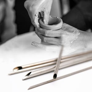 May include: A set of five stainless steel pottery tools with different shaped tips. The tools are used for shaping and smoothing clay.
