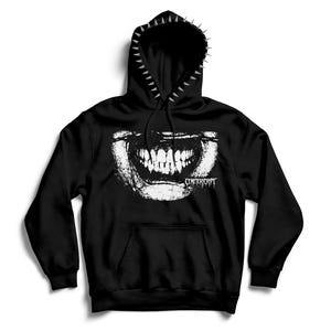 May include: A black hooded sweatshirt featuring a white graphic print of a wide, toothy grin across the chest with the text CEMETERYCRYPT. The hood is lined with a row of silver-colored metal spikes along the outer edge and includes black drawstrings.