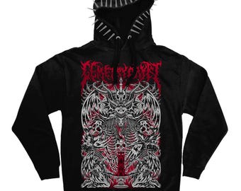 May include: A black hooded sweatshirt featuring a row of silver spikes along the hood edge. The front displays a detailed graphic in red, white, and black, depicting a winged demonic figure with skulls and a chalice, with illegible text above.
