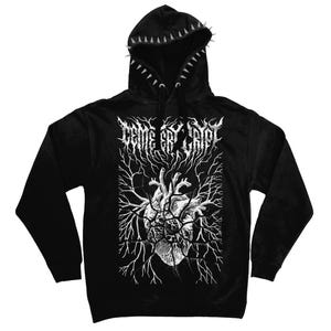 May include: A black long-sleeve hoodie featuring a white graphic of an anatomical heart surrounded by branching lines and the text "CEMETERY CRYPT" in a stylised font. The hood edge is lined with a row of silver-coloured metal spikes.