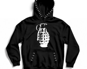 May include: A black hooded sweatshirt featuring a white graphic print of a hand grenade on the chest. The hood edge and the top of the front kangaroo pocket are decorated with a row of silver-colored metal spikes along the seams.