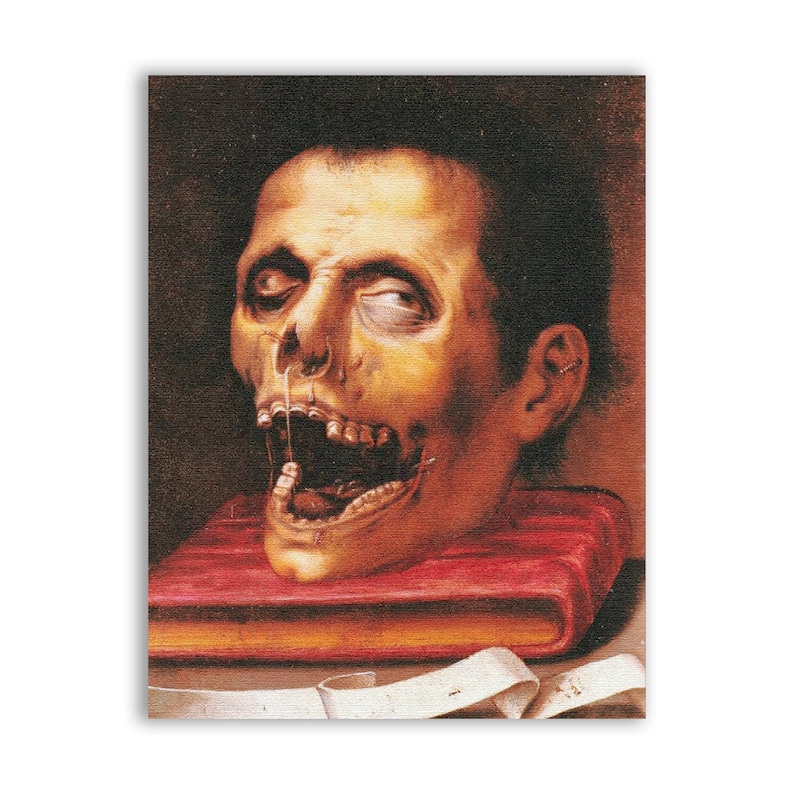 Peut inclure: Une peinture repr&eacute;sentant une t&ecirc;te coup&eacute;e avec la bouche ouverte, reposant sur un livre rouge. La t&ecirc;te est p&acirc;le et pr&eacute;sente une repr&eacute;sentation r&eacute;aliste du cr&acirc;ne et des dents. L'arri&egrave;re-plan est sombre.