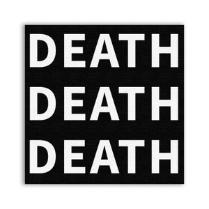 May include: Black and white canvas patch with the word "DEATH" repeated three times in a vertical stack.