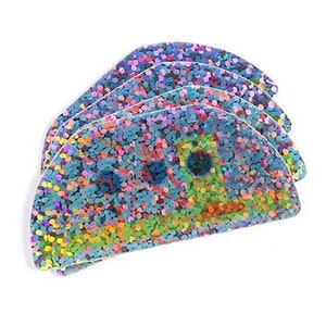 May include: A set of four iridescent blue, pink, and green glitter shaped like a half-circle.