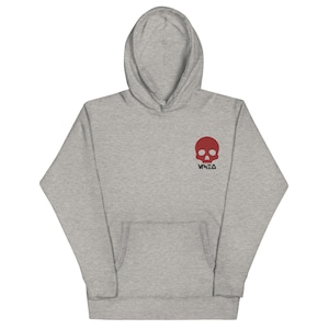 May include: A gray hooded sweatshirt with a red skull graphic and the word "VKED" printed below it.