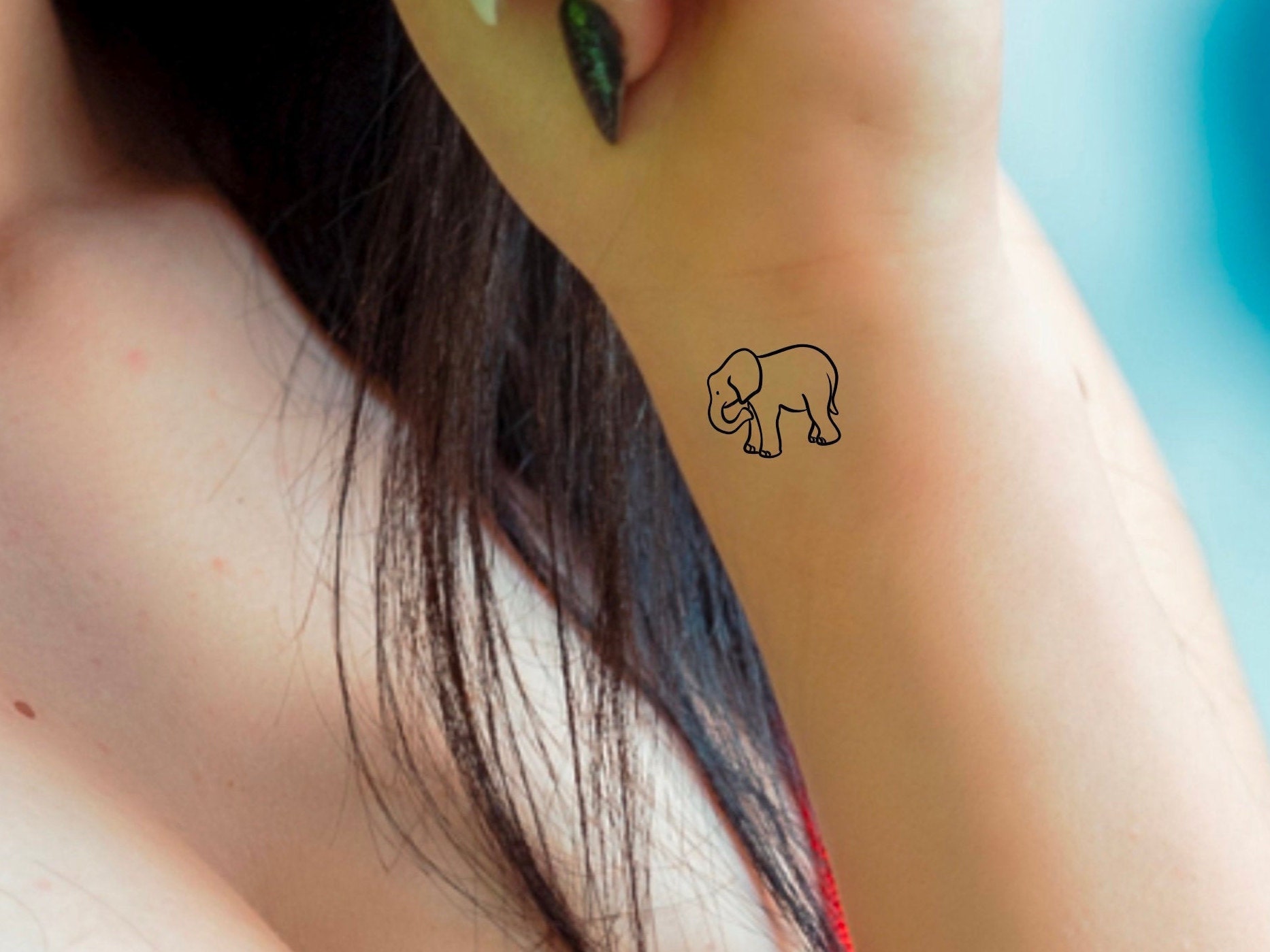 Small Elephant Tattoo Behind Ear
