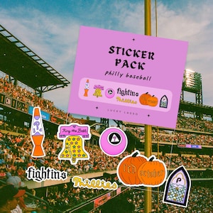 May include: A sticker pack featuring Philly baseball designs on a light purple background. The stickers include a lava lamp, a bell with stars, a pink ball, two orange pumpkins labeled Red October, and a stained glass window with a letter P.