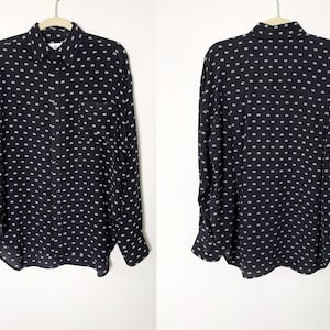 Balenciaga All Over Logo Black Oversized Long Sleeve Silk Button Up Shirt With Front Pocket.