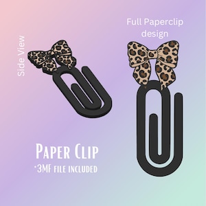 Puede incluir: Clip de papel negro con diseño de lazo con estampado de leopardo. La imagen incluye el texto "Paper Clip" y "3MF file included". El lazo es de color beige con manchas marrones.