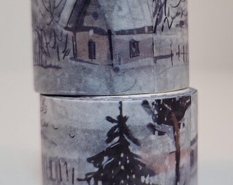 May include: Two rolls of washi tape with a winter landscape design. The illustration features a house, trees, and a fence in a snowy scene. The color palette is primarily gray, white, and brown.