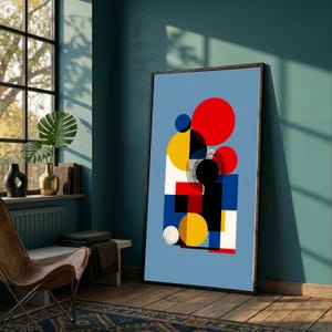Puede incluir: Impresión artística abstracta con un diseño geométrico. Presenta formas rojas, amarillas, azules, negras y blancas sobre un fondo azul claro. La obra está enmarcada en un marco negro.