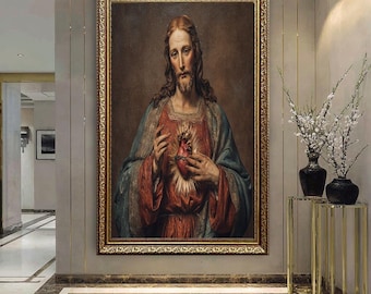 May include: A framed portrait of a religious figure, depicting a man with long brown hair and a beard, wearing a red and blue robe. The man holds a flaming heart. The artwork is in a gold ornate frame.