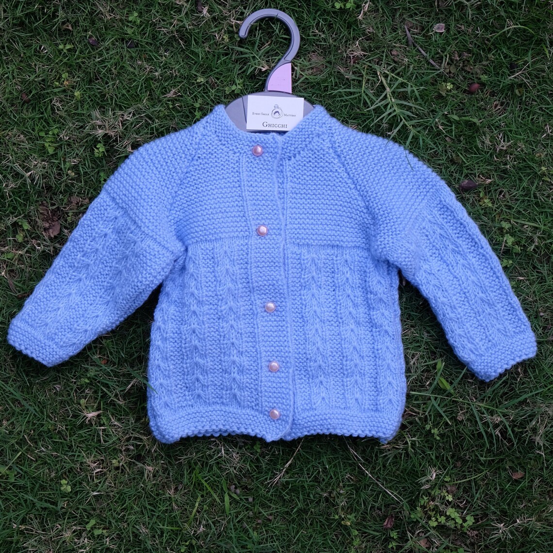 Blue cardigan with matching pearl shaped buttons for babies. Etsy