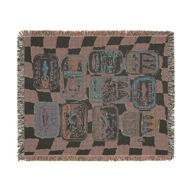 May include: A woven throw blanket with a checkerboard pattern in black and brown. The blanket features a repeating pattern of rectangular shapes with various designs and colors, including blue, green, and orange. The edges are fringed.