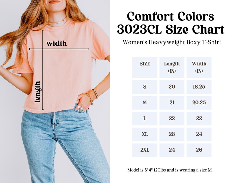 May include: A peach-colored Comfort Colors 3023CL heavyweight boxy t-shirt. The image includes a size chart with measurements in inches for sizes S to 2XL. The model is 5' 4" and 120lbs, wearing a size M.