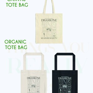 May include: Two tote bags, one white and one black, with the text "Proud Members of Dramione Readers Society" and a graphic design of a house and other symbols. The white tote bag is labeled "Canvas Tote Bag" and the black tote bag is labeled "Organic Tote Bag".