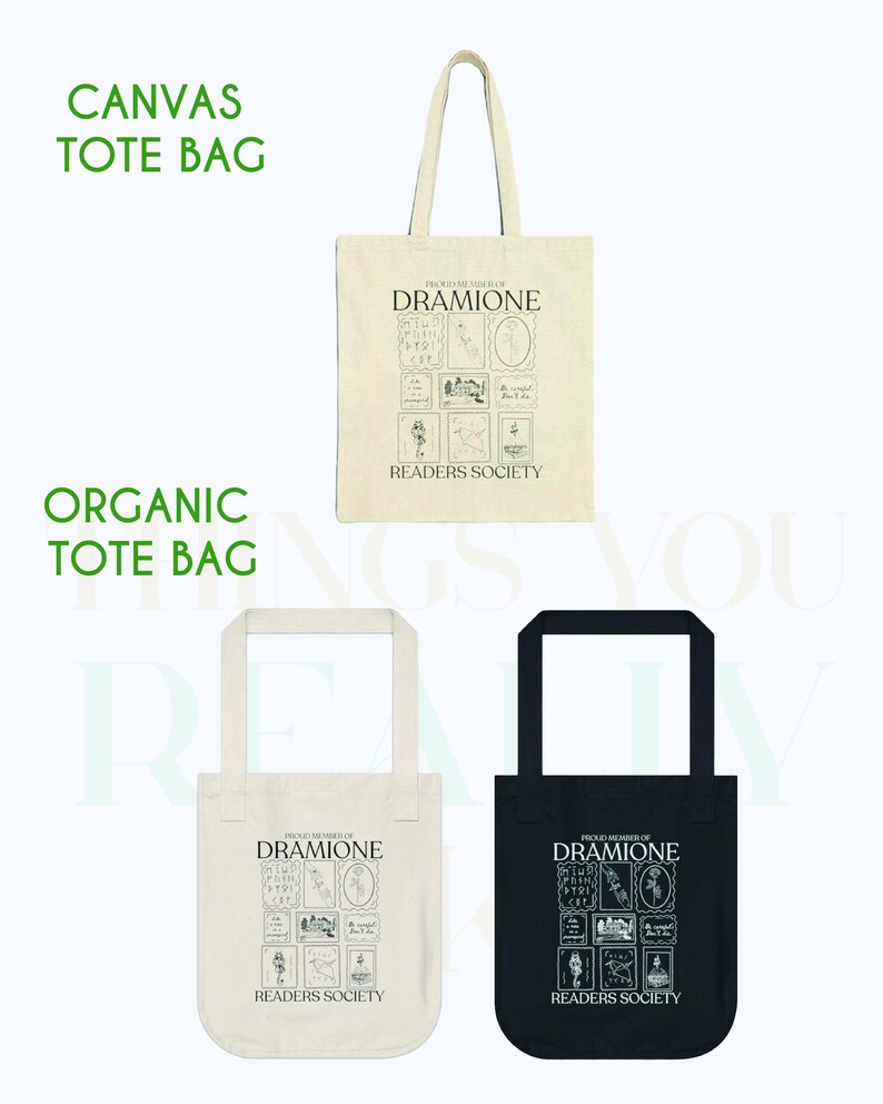 May include: Two tote bags, one white and one black, with the text "Proud Members of Dramione Readers Society" and a graphic design of a house and other symbols. The white tote bag is labeled "Canvas Tote Bag" and the black tote bag is labeled "Organic Tote Bag".