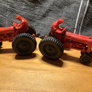 Vintage Auburn red rubber tractors