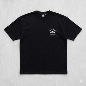 May include: Black t-shirt with a white graphic on the chest that reads "TACTICAL SAVAGE" above two crossed rifles. The shirt has a crew neck and short sleeves. The shirt is made of a soft material.