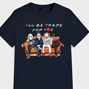 May include: Navy blue t-shirt featuring a cartoon illustration of horror movie characters sitting on a couch. The text "I'LL BE THERE FOR YOU" is above the characters. The characters include Jason Voorhees, Michael Myers, Pennywise, and Freddy Krueger.
