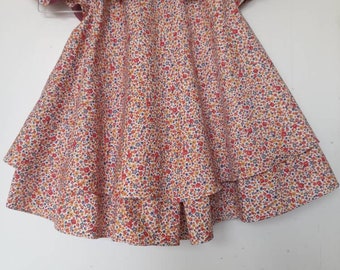 A girl's floral dress with collar and short sleeves,two layer, flayer dress with lining.