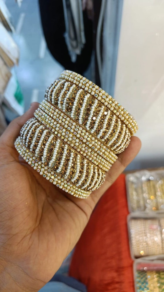 Gold moti bangles deals