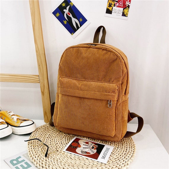 red corduroy backpack