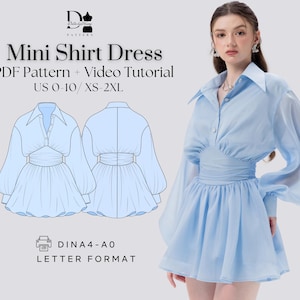 May include: A digital illustration of a light blue mini shirt dress with a collared neckline and long sleeves. The dress has a fitted bodice and a gathered skirt. The text "Mini Shirt Dress" is at the top of the image, and the text "PDF Pattern + Video Tutorial" is below it. The text "US 0-10/XS-2XL" is below that. The text "DINA4-A0 LETTER FORMAT" is at the bottom of the image.