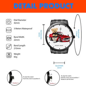 May include: Black wristwatch with a white face featuring a teddy bear driving a red car. The watch has a 42mm dial, is 3 meters waterproof, and has a 22mm band width and 210mm band length. The watch weighs 82g.