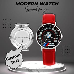 May include: A modern watch with a red leather band and a black face featuring a speedometer design with the BMW logo. The watch face displays the text "km/h" and "M". The image also shows a watch back with the text "CUSTOM TEXT". The words "MODERN WATCH" and "Special for you" are at the top.