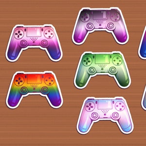 May include: Ten colorful video game controllers with rainbow gradients. The controllers are arranged in two rows of five, with each row featuring a different color scheme.