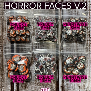 May include: Six clear plastic bags with various horror character clay slices. The bags are labeled with the character name and size. The characters are Chucky, Freddy, and Pennywise. The sizes are 5mm and 10mm. The bags are on a wooden surface.
