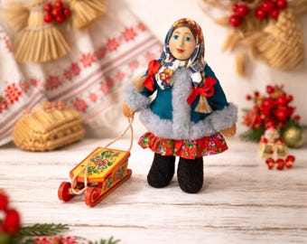 Handmade Winter Folk Doll with Wooden Sled – Rustic Christmas Decor, Traditional Cloth Doll, Holiday Shelf Decoration, Unique Christmas Gift