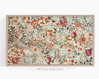 May include: A framed print of a vintage floral pattern with intricate details in shades of red, orange, green, and blue on a white background. The pattern features stylised leaves, flowers, and vines.