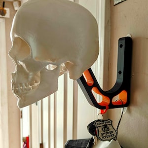Wall Mounted Motorcycle Helmet Holder • Skull Design with dual-tone bracket • Multiple colors, great biker gift