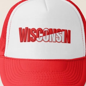 May include: A red and white trucker hat with the word "WISCONSIN" embroidered in red. The hat features a red brim and mesh back, with a white front panel. The text is in a bold, blocky font.